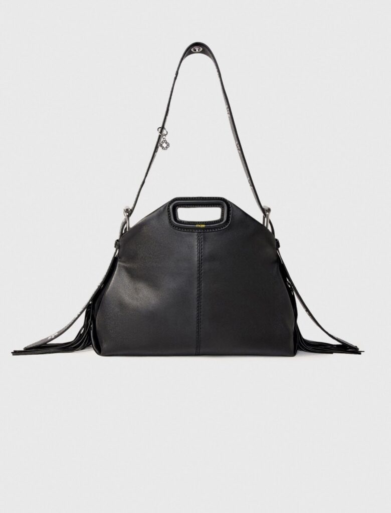 Sac Miss M de Maje en cuir lisse noir, poignée rectangulaire gainée et franges, bandoulière à œillets