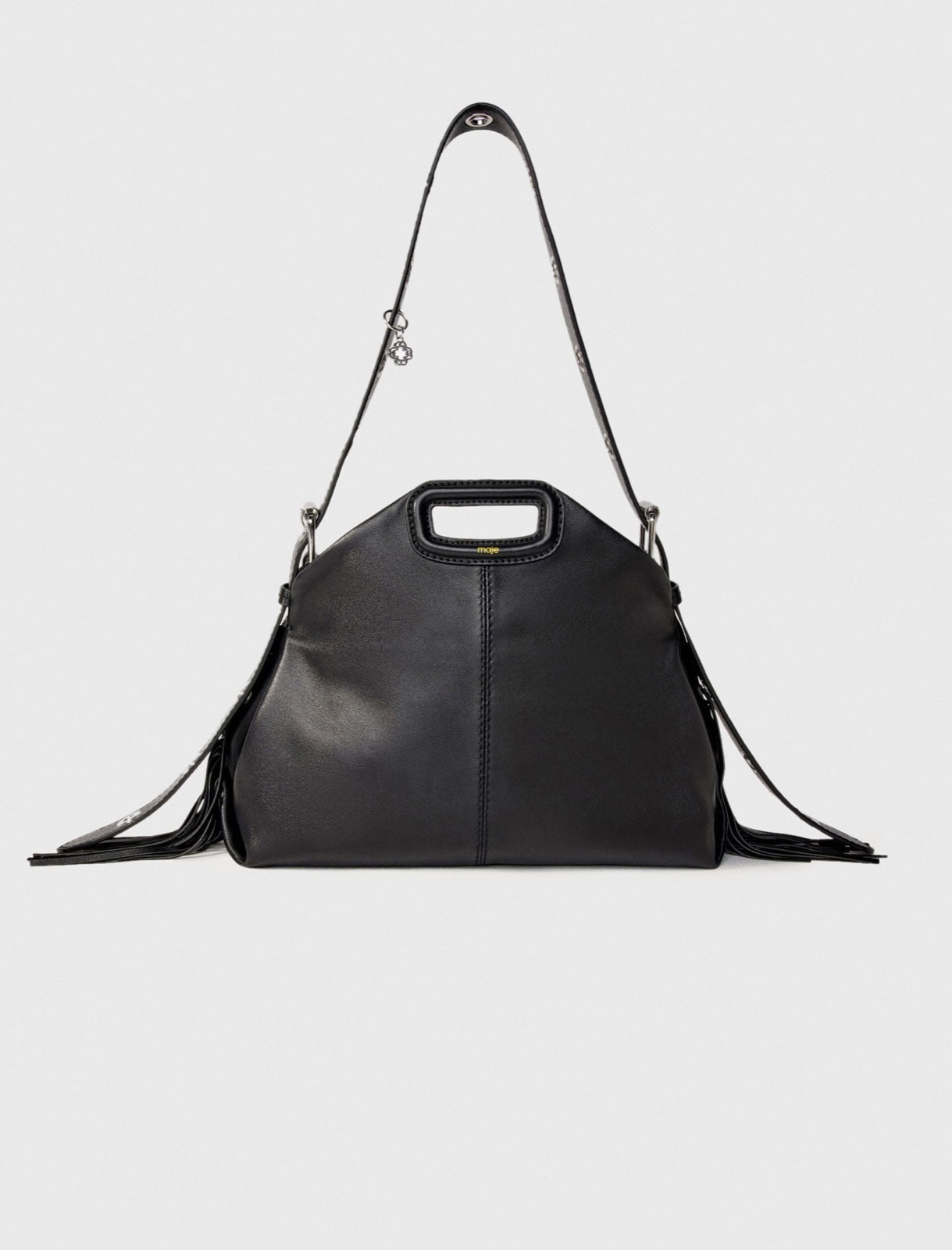 Sac Miss M de Maje en cuir lisse noir, poignée rectangulaire gainée et franges, bandoulière à œillets