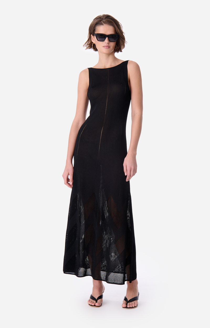 Robe longue Émeraude noire en maille de viscose de Vanessa Bruno, encolure bateau et transparences graphiques au bas de la jupe