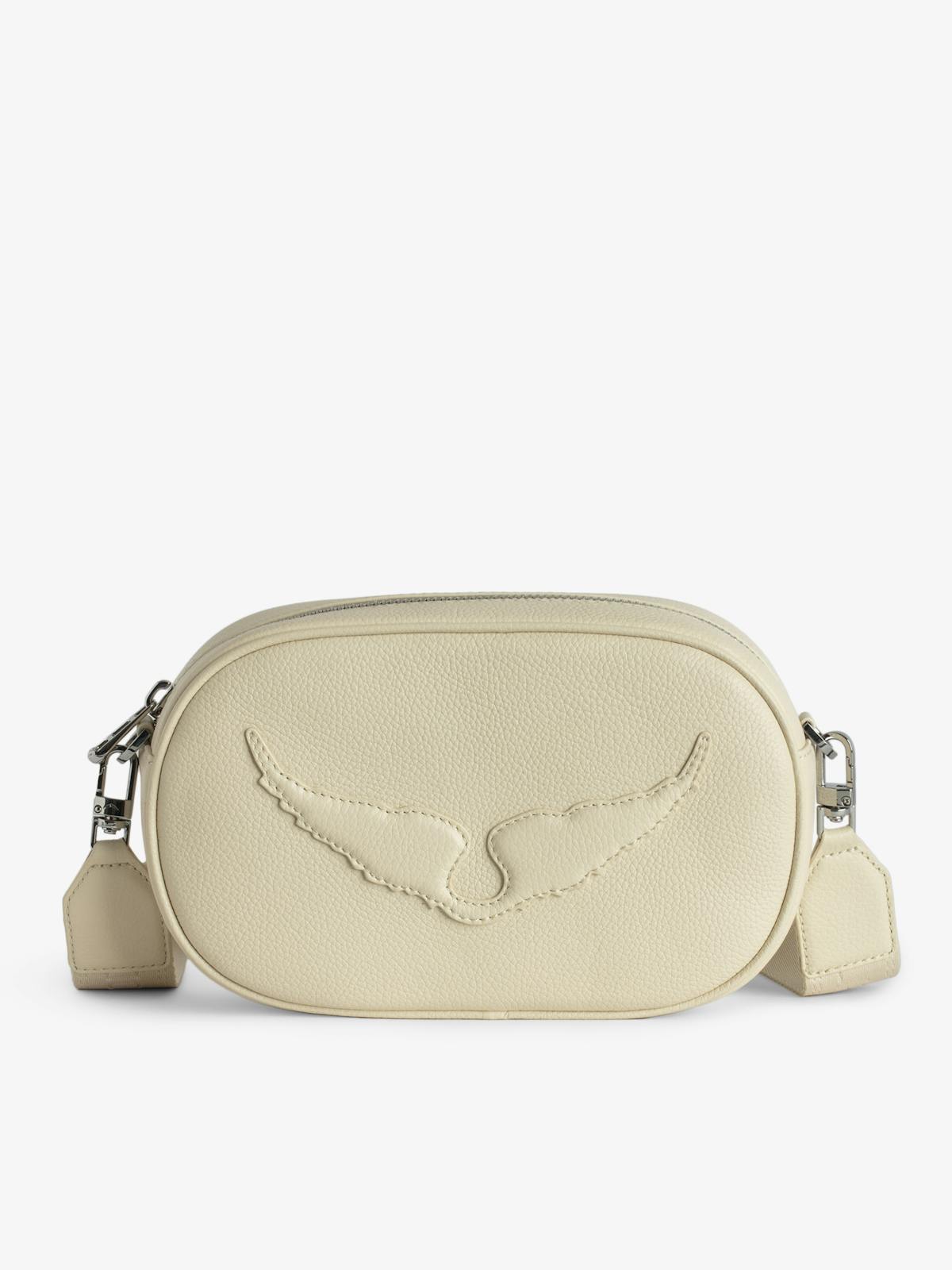 Sac Rock With You de Zadig&Voltaire en cuir grainé écru, format camera bag avec ailes embossées et bandoulière