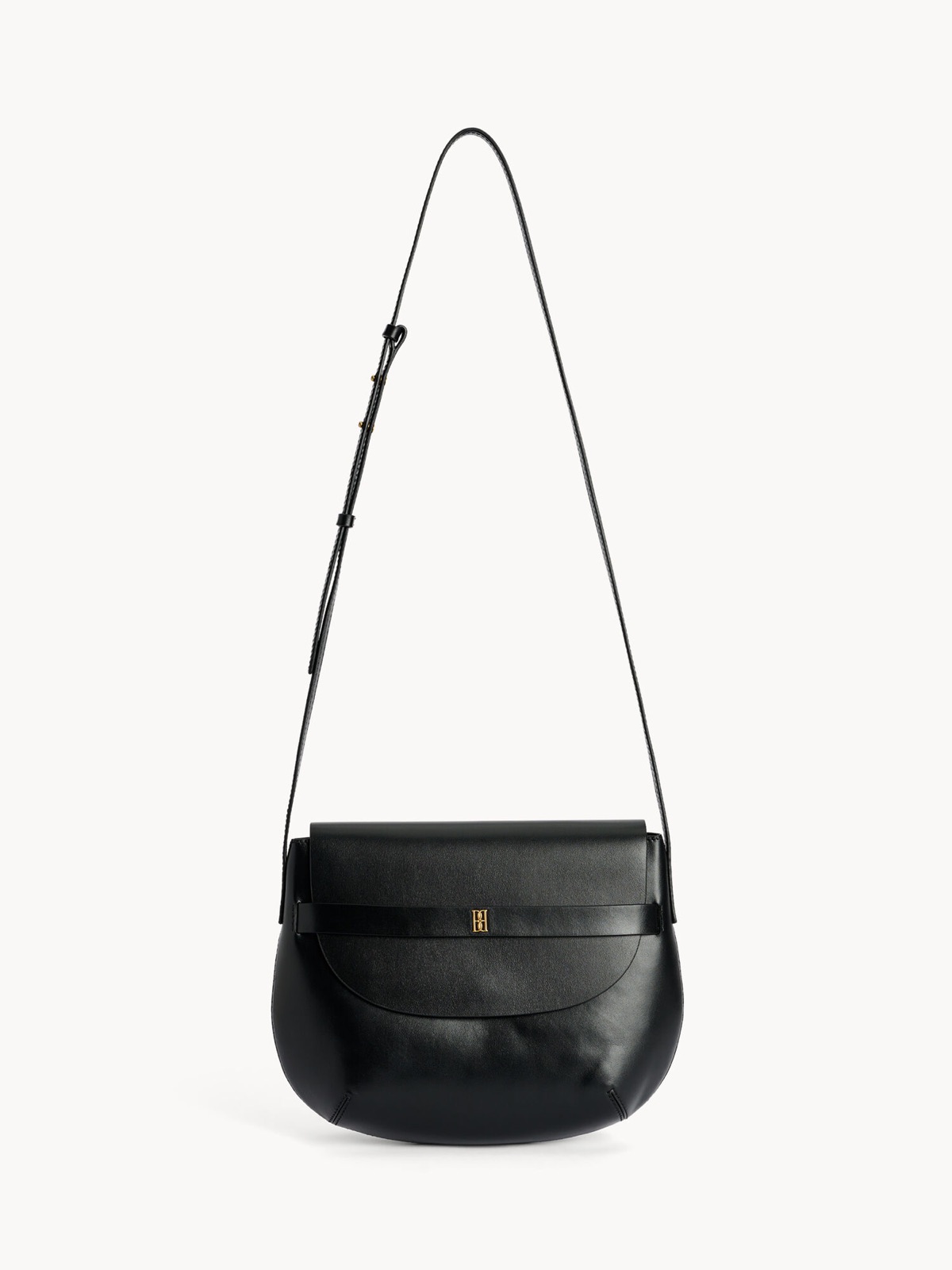Sac Maellon en cuir noir de By Malene Birger, silhouette arrondie, bandouliere ajustable et monogramme dore