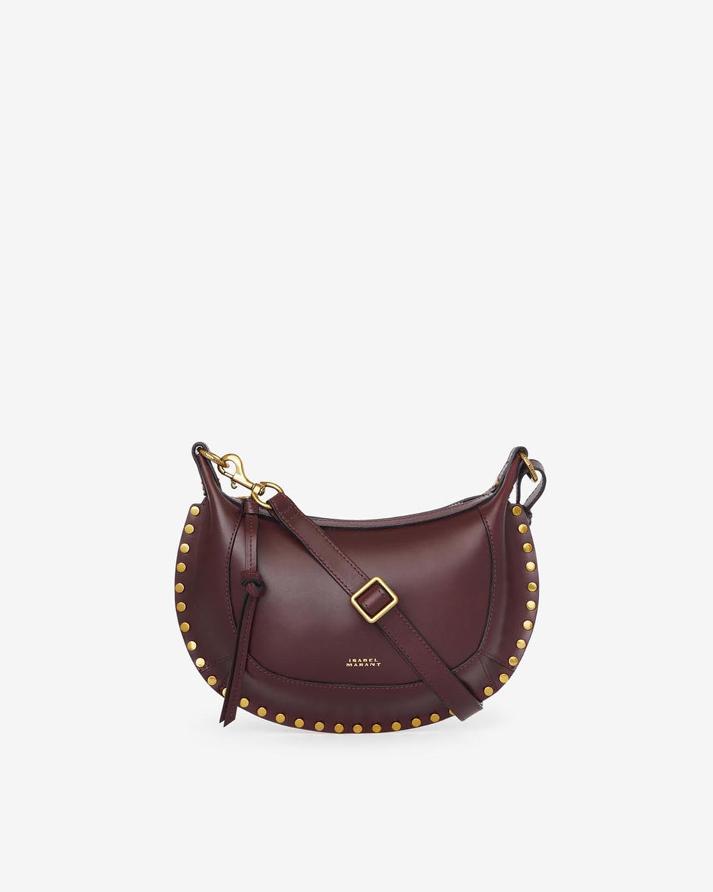 Sac Oskan Moon d'Isabel Marant en cuir bordeaux, forme demi-lune bordée de clous dorés et bandouliere ajustable
